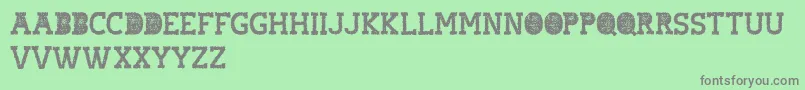 フォントhostile headline – 緑の背景に灰色の文字