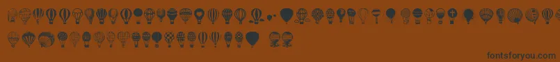 Fonte Hot Air Balloons – fontes pretas em um fundo marrom