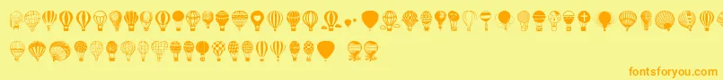 フォントHot Air Balloons – オレンジの文字が黄色の背景にあります。