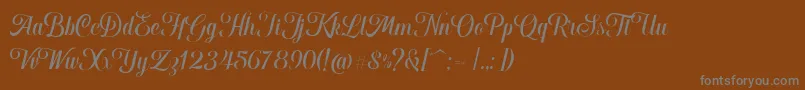 Czcionka Hougbon Script – szare czcionki na brązowym tle
