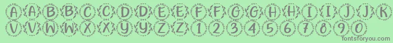 Hugme Font by 7NTypes Font – Gray Fonts on Green Background