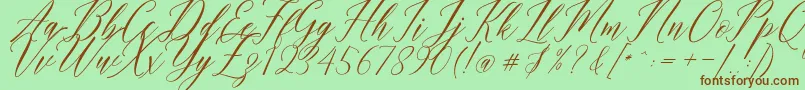 Humairah Script Font – Brown Fonts on Green Background