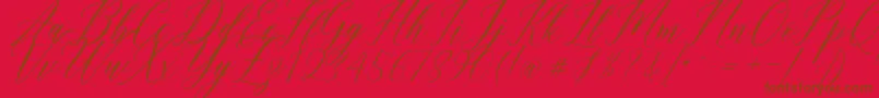 Humairah Script Font – Brown Fonts on Red Background
