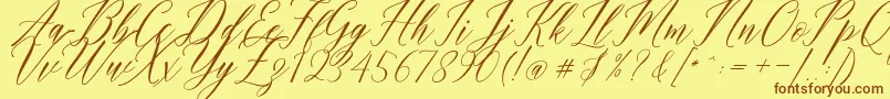 Fonte Humairah Script – fontes marrons em um fundo amarelo