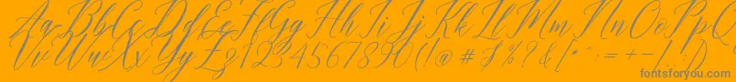 Fonte Humairah Script – fontes cinzas em um fundo laranja