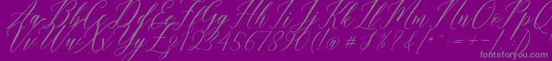 Fonte Humairah Script – fontes cinzas em um fundo violeta