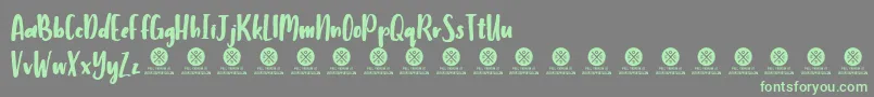 Fonte Humbley Script Demo – fontes verdes em um fundo cinza