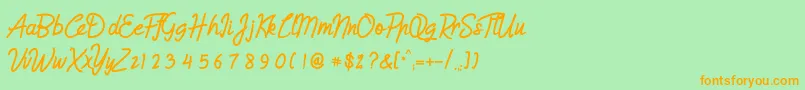 Humienly Font – Orange Fonts on Green Background