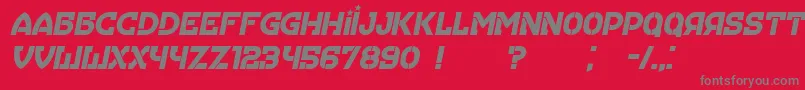 Hungaria Italic-fontti – harmaat kirjasimet punaisella taustalla