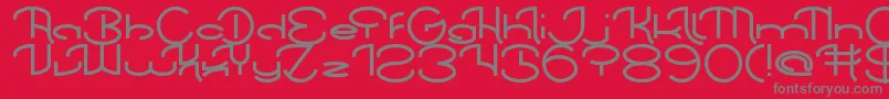 フォントChintyaAwuy – 赤い背景に灰色の文字