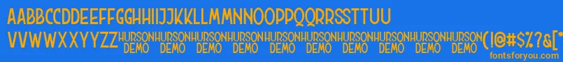 Hurson Clean Font – Orange Fonts on Blue Background