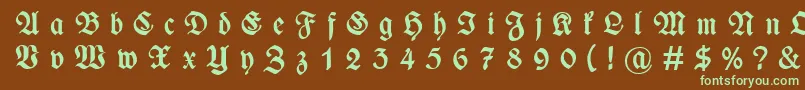 フォントWieynckfrakturGesperrtfettunz1l – 緑色の文字が茶色の背景にあります。