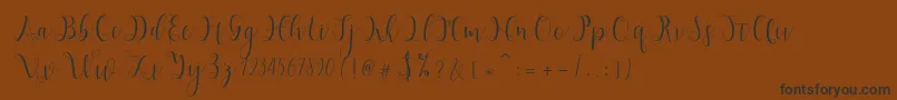 フォントHypatia – 黒い文字が茶色の背景にあります