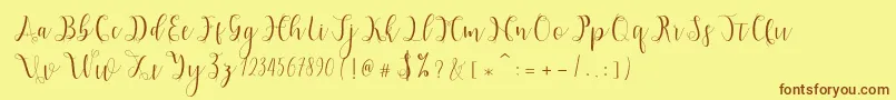 フォントHypatia – 茶色の文字が黄色の背景にあります。