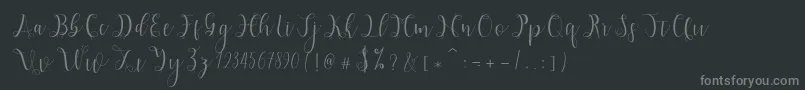 Hypatia-fontti – harmaat kirjasimet mustalla taustalla