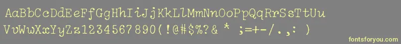 IBM Selectric Light Regular Font – Yellow Fonts on Gray Background