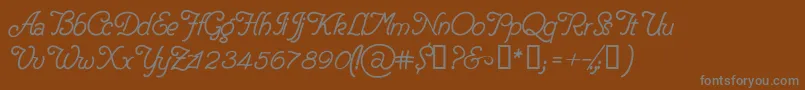 DelicacyPersonalUseOnly-fontti – harmaat kirjasimet ruskealla taustalla