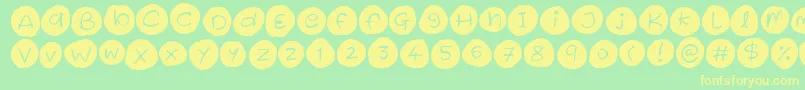 フォントIced Cookies – 黄色の文字が緑の背景にあります