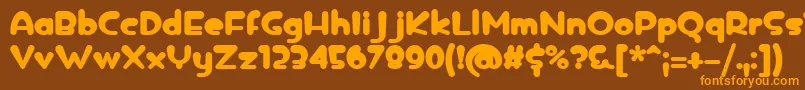 フォントicedrop bold – オレンジ色の文字が茶色の背景にあります。