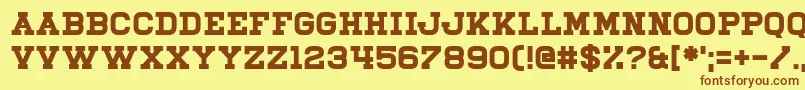 フォントIlliead – 茶色の文字が黄色の背景にあります。