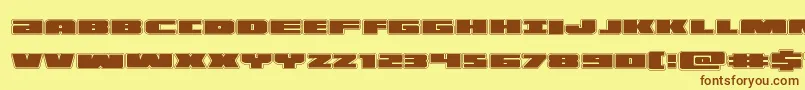フォントilluminoacad – 茶色の文字が黄色の背景にあります。