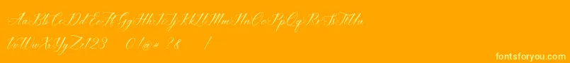 Czcionka imata Script DEMO – żółte czcionki na pomarańczowym tle