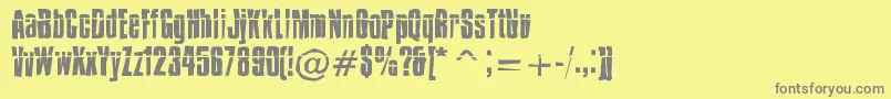 IMPOSSD -fontti – harmaat kirjasimet keltaisella taustalla
