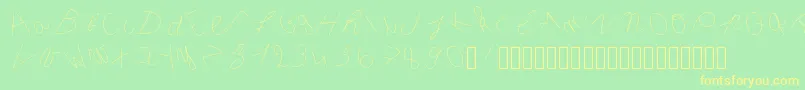 フォントInclinedletter – 黄色の文字が緑の背景にあります
