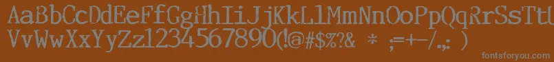 Incognitype-fontti – harmaat kirjasimet ruskealla taustalla