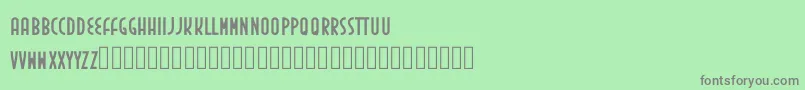 フォントInedita – 緑の背景に灰色の文字