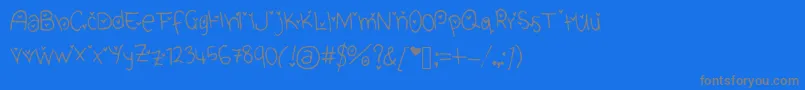 CuteHeartFont-Schriftart – Graue Schriften auf blauem Hintergrund