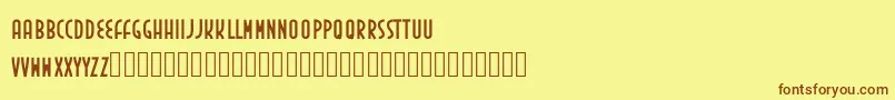 フォントInedita – 茶色の文字が黄色の背景にあります。