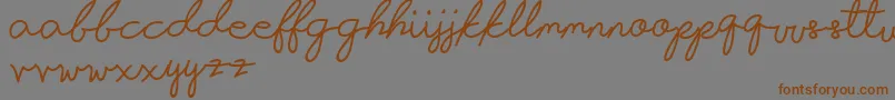 Infatuation-Schriftart – Braune Schriften auf grauem Hintergrund
