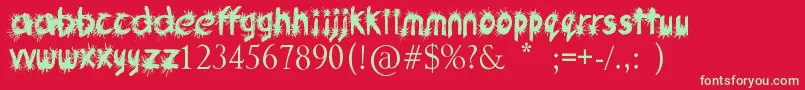 Czcionka Ink Studio – zielone czcionki na czerwonym tle