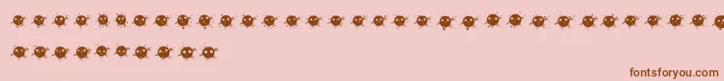 InkDrops-Schriftart – Braune Schriften auf rosa Hintergrund