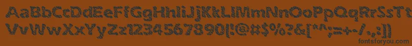 inkswipe-fontti – mustat fontit ruskealla taustalla