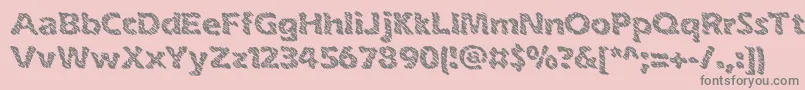 inkswipe-fontti – harmaat kirjasimet vaaleanpunaisella taustalla