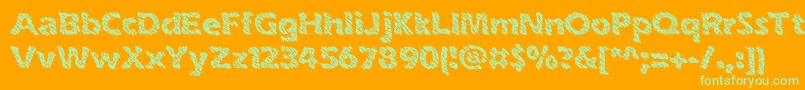 inkswipe-fontti – vihreät fontit oranssilla taustalla