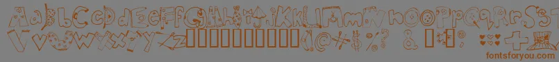 フォントInmyc    – 茶色の文字が灰色の背景にあります。