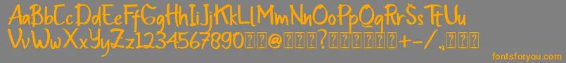 フォントInsomenest – オレンジの文字は灰色の背景にあります。