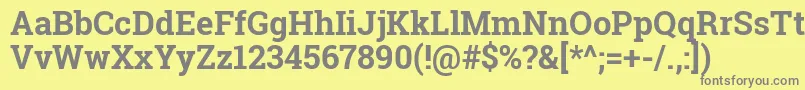 Robotoslab-fontti – harmaat kirjasimet keltaisella taustalla