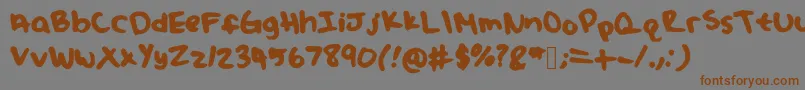 フォントJuliafont – 茶色の文字が灰色の背景にあります。