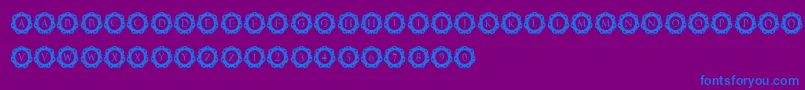 フォントInternationalCapitals – 紫色の背景に青い文字
