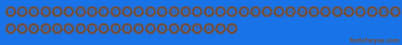 フォントInternationalCapitals – 茶色の文字が青い背景にあります。