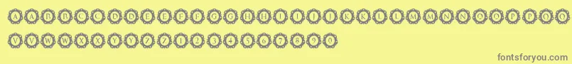 InternationalCapitals-fontti – harmaat kirjasimet keltaisella taustalla