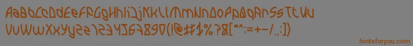 フォントINTERPLANETARY – 茶色の文字が灰色の背景にあります。