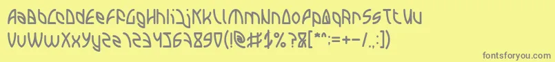フォントINTERPLANETARY – 黄色の背景に灰色の文字