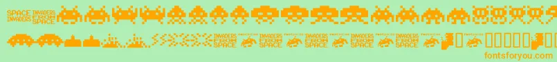 invaders from space fontvir us-Schriftart – Orangefarbene Schriften auf grünem Hintergrund