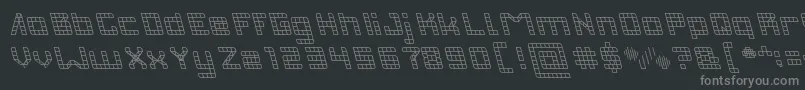 INVASION-fontti – harmaat kirjasimet mustalla taustalla