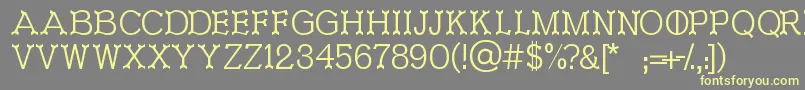 Ironworks Font – Yellow Fonts on Gray Background